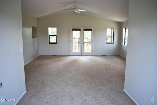 empty room with carpet, baseboards, vaulted ceiling, and ceiling fan