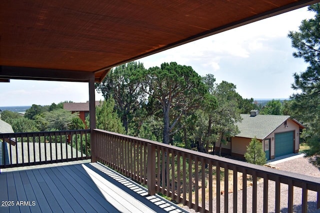 wooden terrace with a garage