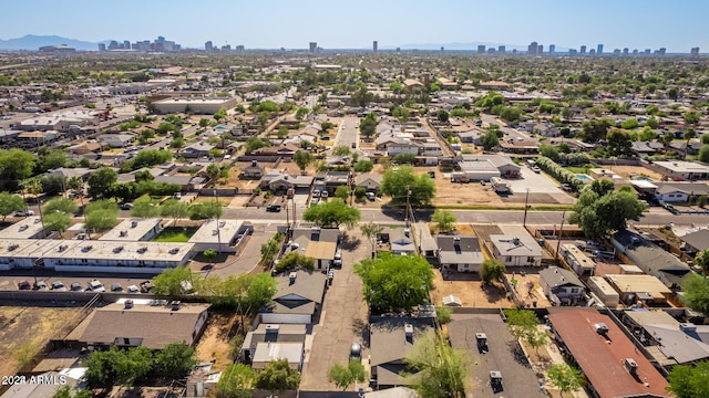 birds eye view of property with a mountain view