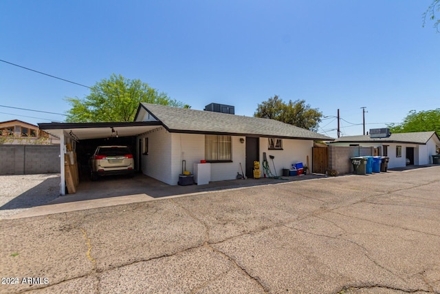 ranch-style home with a carport