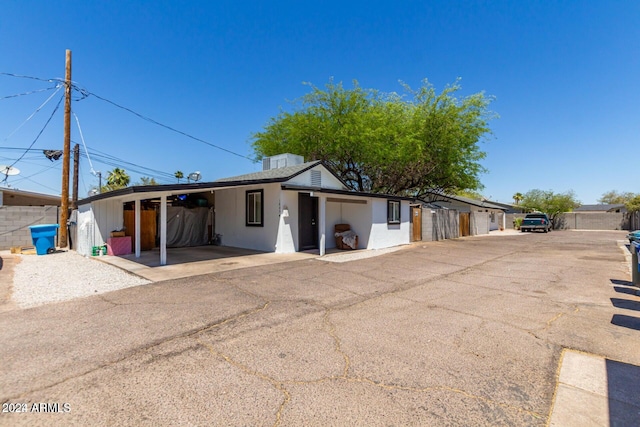 view of front of house featuring a carport