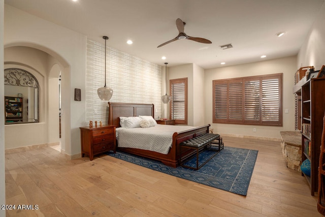 bedroom with light wood-type flooring and ceiling fan