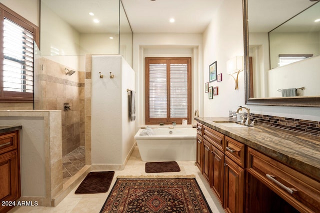 bathroom with vanity, backsplash, tile patterned floors, and shower with separate bathtub