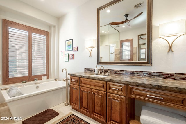 bathroom featuring a bath, ceiling fan, tile patterned floors, vanity, and decorative backsplash