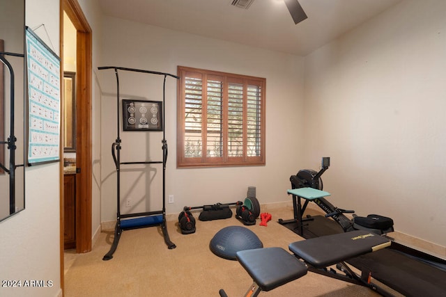 workout area with light carpet and ceiling fan