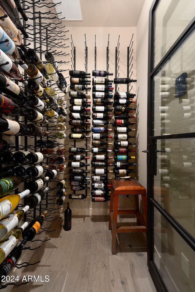 wine cellar featuring wood-type flooring