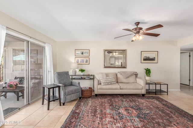 living area featuring light tile patterned floors and a ceiling fan