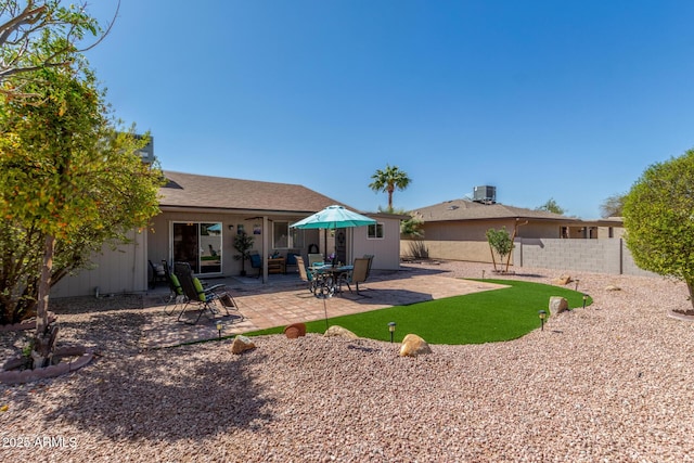 back of house with a patio, fence, and central AC