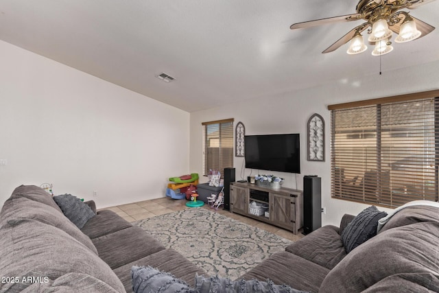 living room with light tile patterned floors and ceiling fan