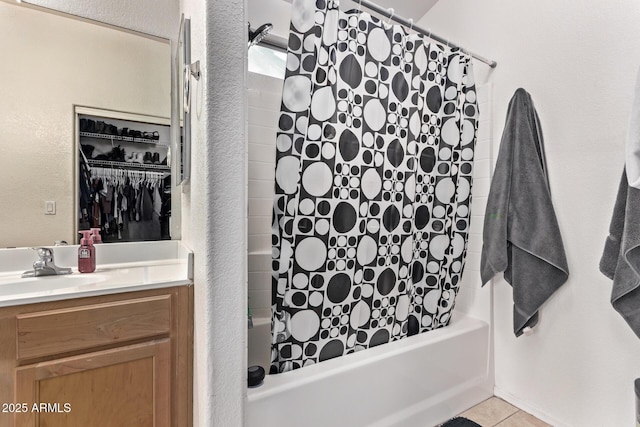 bathroom featuring shower / bath combination with curtain, vanity, and tile patterned flooring