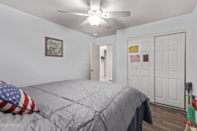 bedroom with ceiling fan, dark hardwood / wood-style floors, and a closet