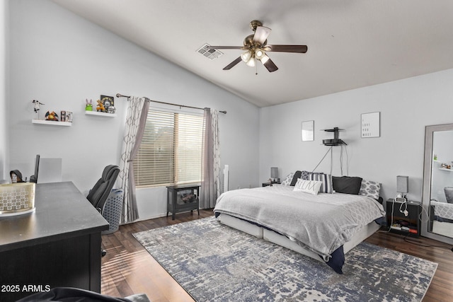 bedroom featuring ceiling fan, lofted ceiling, and dark hardwood / wood-style flooring