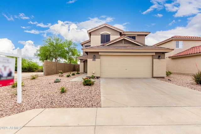 864 S 223rd Ln, Buckeye, AZ 85326 - view of front of home with concrete driveway, stucco siding, and an attached garage