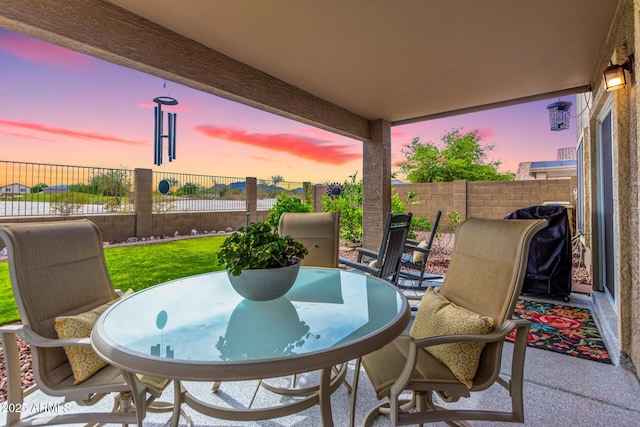 864 S 223rd Ln, Buckeye, AZ 85326 - fenced backyard with a patio area and outdoor dining space