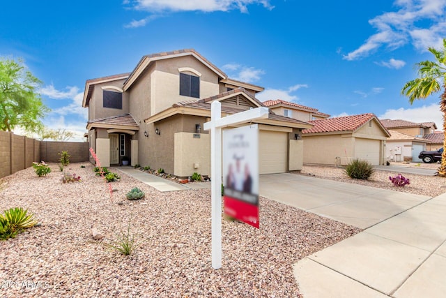 864 S 223rd Ln, Buckeye, AZ 85326 - view of front facade with driveway, stucco siding, an attached garage, and a tiled roof