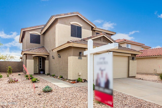 864 S 223rd Ln, Buckeye, AZ 85326 - view of front facade featuring stucco siding, driveway, and a tiled roof