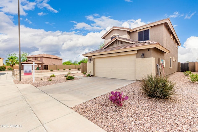 864 S 223rd Ln, Buckeye, AZ 85326 - view of front of house with stucco siding, driveway, a tiled roof, and an attached garage