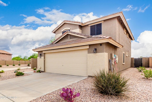 864 S 223rd Ln, Buckeye, AZ 85326 - view of front of property featuring stucco siding, driveway, a gate, a tiled roof, and a garage