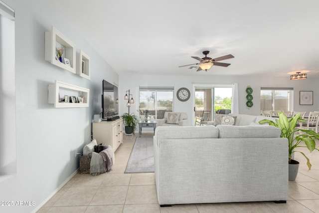 864 S 223rd Ln, Buckeye, AZ 85326 - living area with light tile patterned flooring and a ceiling fan