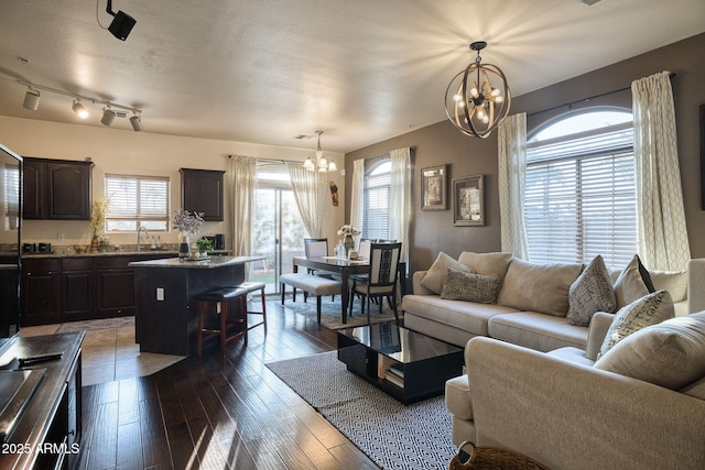 17150 N 23rd St Unit 125, Phoenix, AZ 85022 - living room with a chandelier and hardwood / wood-style floors