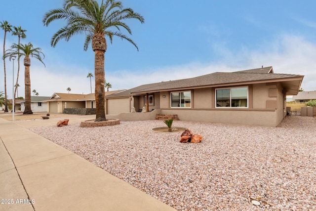 ranch-style home featuring a garage