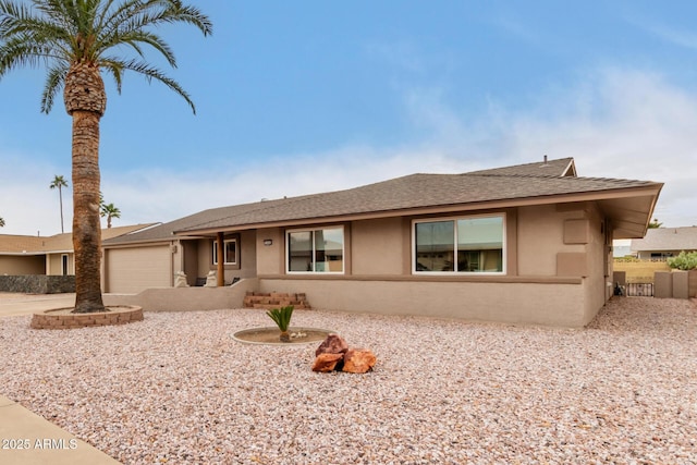 single story home featuring a garage