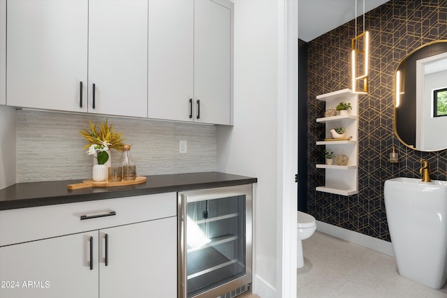 bar featuring white cabinets and wine cooler