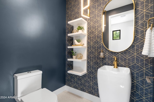 bathroom with tile walls and toilet