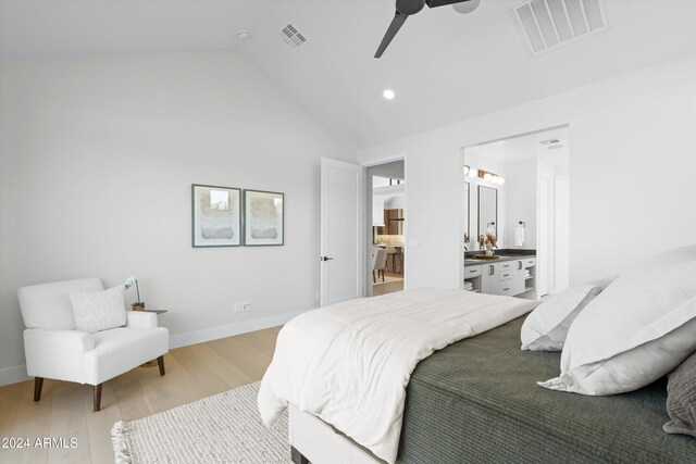 bedroom with connected bathroom, ceiling fan, high vaulted ceiling, and light hardwood / wood-style floors