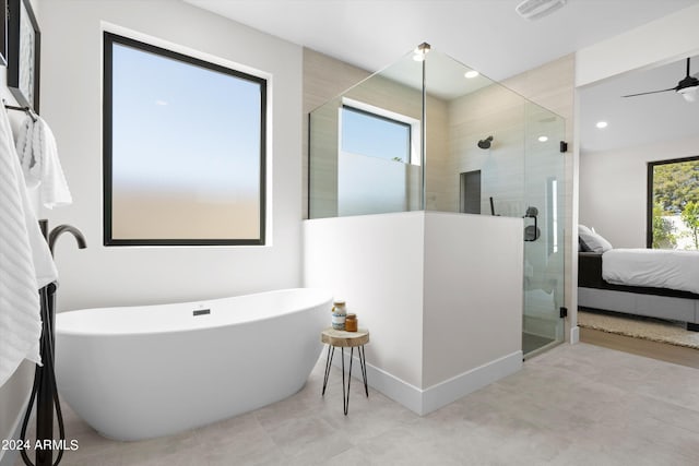 bathroom with separate shower and tub, ceiling fan, and plenty of natural light