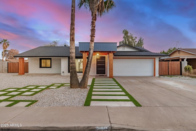 2905 W Campo Bello Dr, Phoenix, AZ 85053 - view of front of house featuring a garage, fence, and driveway