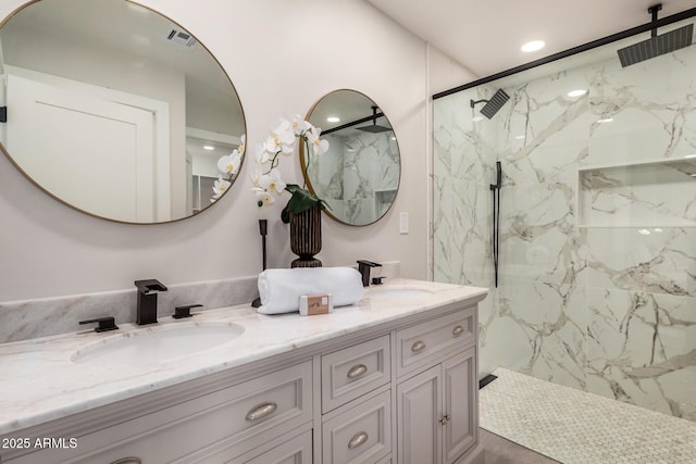 2905 W Campo Bello Dr, Phoenix, AZ 85053 - full bath featuring double vanity, recessed lighting, a marble finish shower, and a sink
