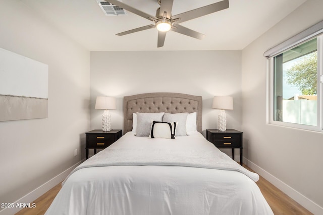 2905 W Campo Bello Dr, Phoenix, AZ 85053 - bedroom featuring a ceiling fan, baseboards, visible vents, and wood finished floors