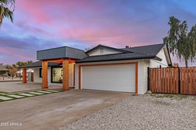 2905 W Campo Bello Dr, Phoenix, AZ 85053 - view of front of property with fence, a shingled roof, an attached garage, brick siding, and driveway