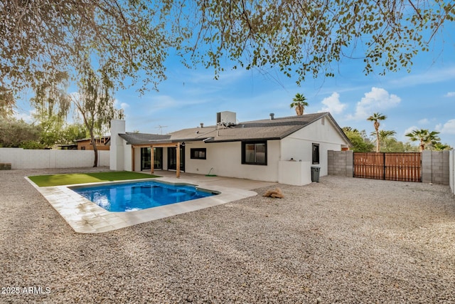 2905 W Campo Bello Dr, Phoenix, AZ 85053 - rear view of house with a fenced in pool, a fenced backyard, a patio area, and a gate