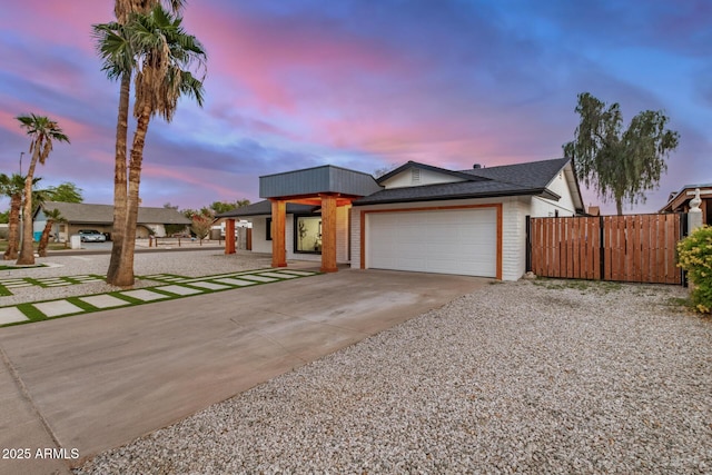 2905 W Campo Bello Dr, Phoenix, AZ 85053 - view of front of home with concrete driveway, an attached garage, fence, and a shingled roof