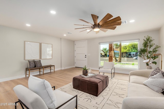 2905 W Campo Bello Dr, Phoenix, AZ 85053 - living area featuring ceiling fan, visible vents, and light wood-style flooring