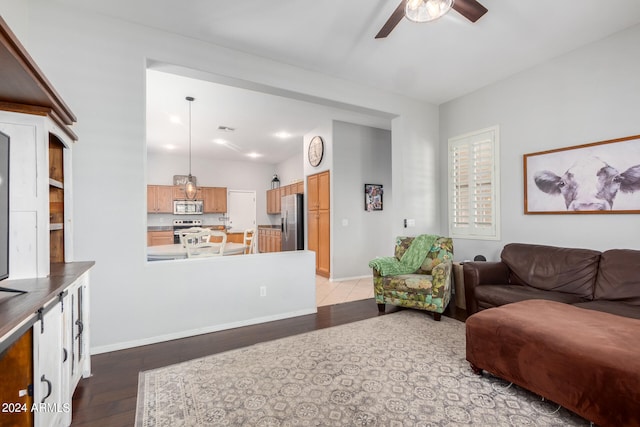 living room featuring ceiling fan and wood-type flooring