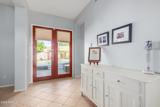 doorway to outside featuring french doors and light tile patterned floors