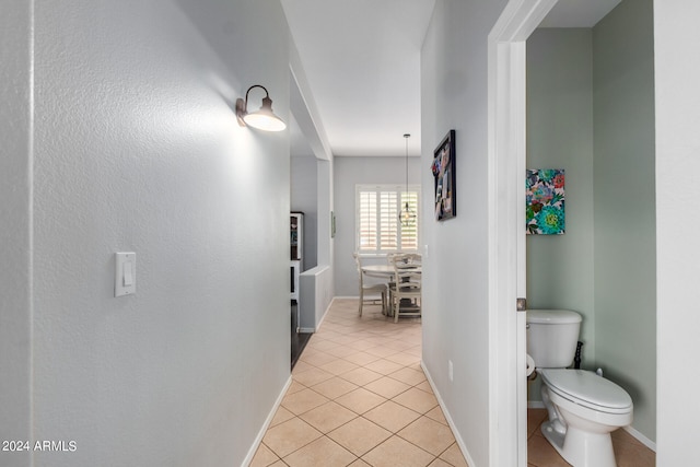 hall with light tile patterned flooring