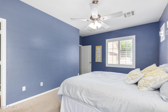 carpeted bedroom featuring ceiling fan