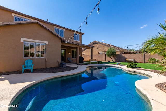 view of swimming pool with a patio