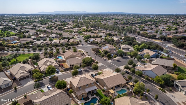 birds eye view of property with a mountain view