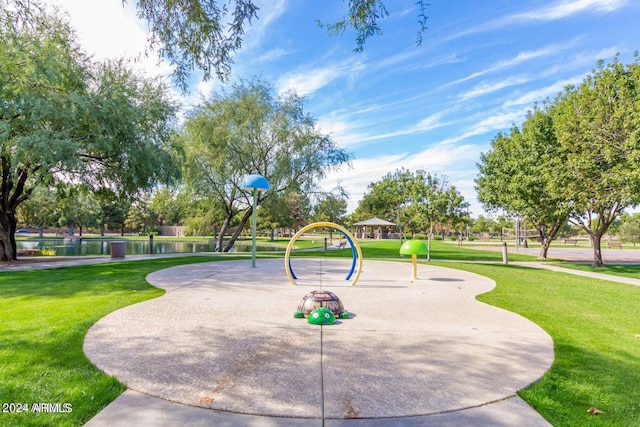 view of property's community featuring a water view and a lawn