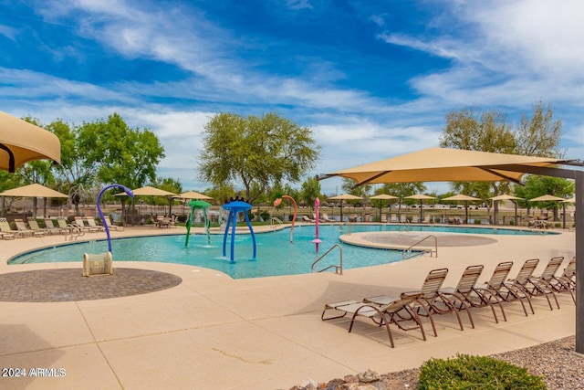 view of swimming pool with a patio area and pool water feature