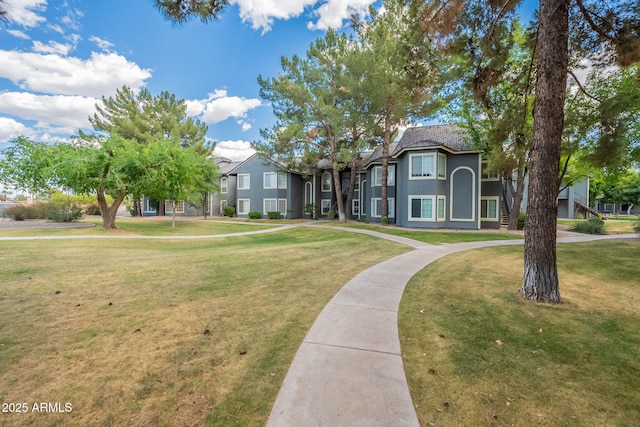 view of front of home with a front lawn and stucco siding