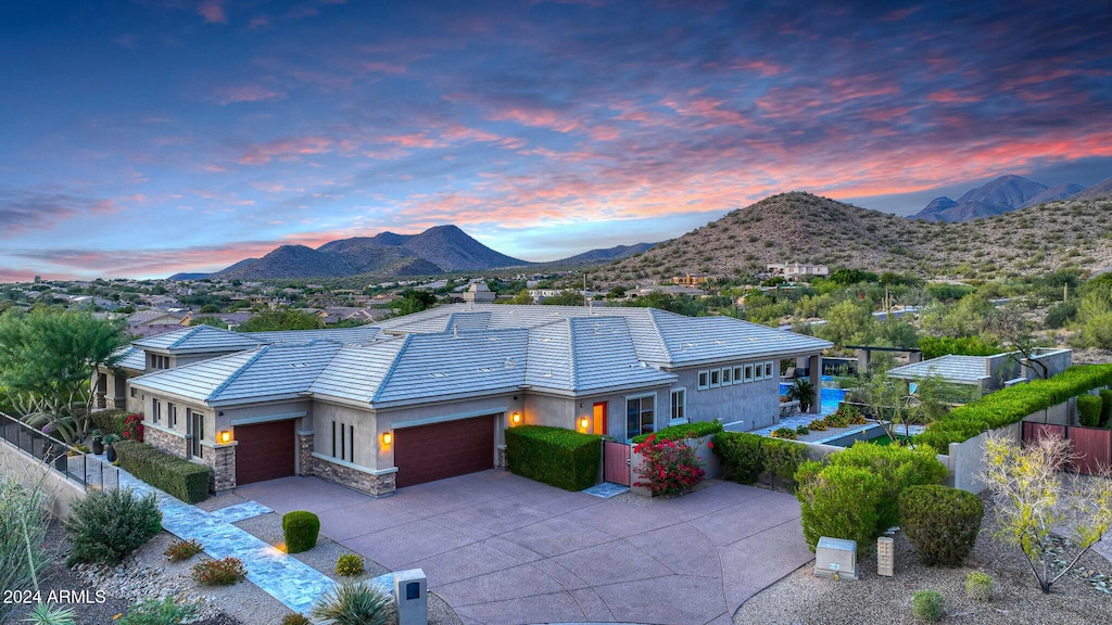 exterior space featuring a mountain view and a garage