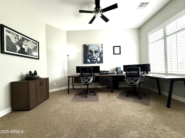 carpeted home office with ceiling fan