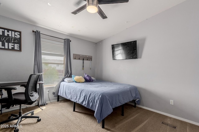 bedroom featuring light carpet, visible vents, baseboards, and lofted ceiling