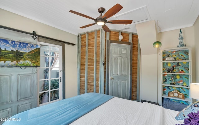 bedroom featuring ceiling fan and visible vents